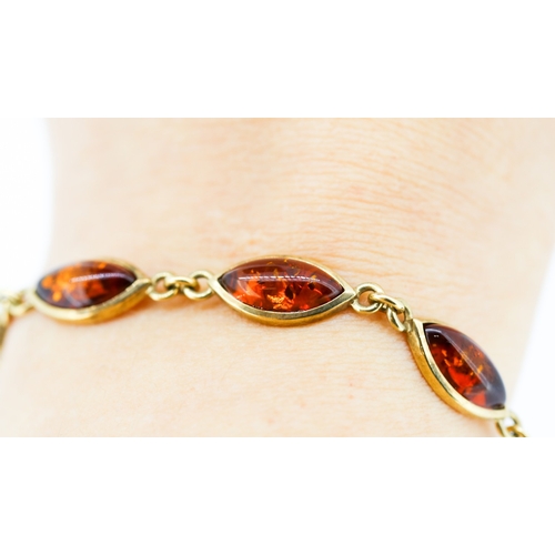61 - Amber Eight Stone Set Bracelet Mounted in 9 Carat Yellow Gold 19.5cm Long