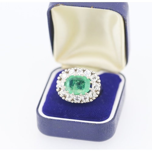 121 - Finely Detailed Emerald Centre Stone Set Ring with Diamond Twelve Stone Halo Set Surround Mounted in... 