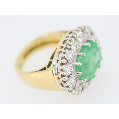 121 - Finely Detailed Emerald Centre Stone Set Ring with Diamond Twelve Stone Halo Set Surround Mounted in... 