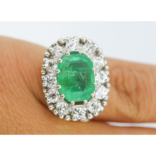 121 - Finely Detailed Emerald Centre Stone Set Ring with Diamond Twelve Stone Halo Set Surround Mounted in... 
