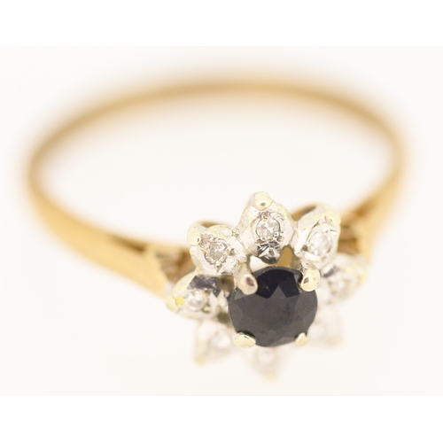 128 - Sapphire and Diamond Set Ladies Daisy Cluster Ring  Mounted in 9 Carat Yellow Gold Ring Size M
