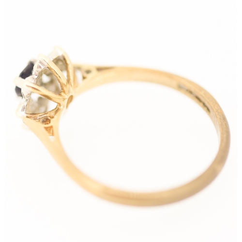 128 - Sapphire and Diamond Set Ladies Daisy Cluster Ring  Mounted in 9 Carat Yellow Gold Ring Size M