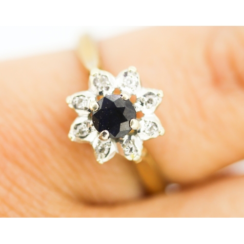 128 - Sapphire and Diamond Set Ladies Daisy Cluster Ring  Mounted in 9 Carat Yellow Gold Ring Size M
