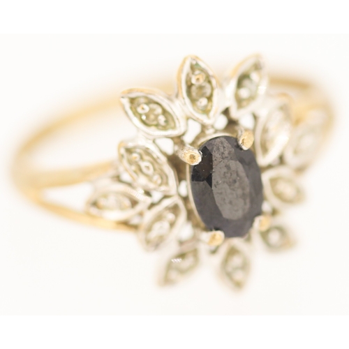 129 - Sapphire and Diamond Set Floral Motif Ring Mounted in 9 Carat Yellow Gold Ring Size L and a Half