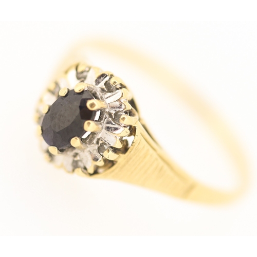 131 - Sapphire Set Ring with Diamond Set Surround Mounted in 9 Carat Yellow Gold Ring Size S