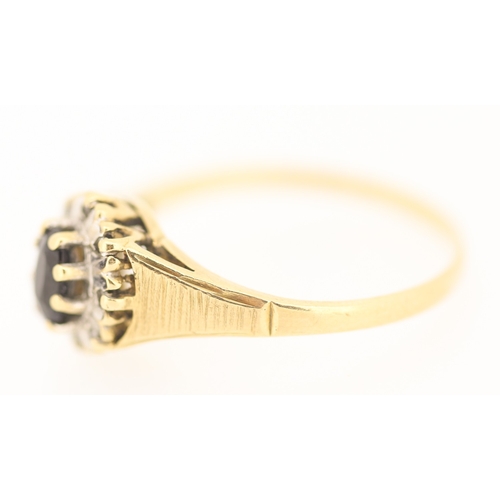 131 - Sapphire Set Ring with Diamond Set Surround Mounted in 9 Carat Yellow Gold Ring Size S