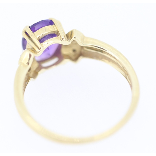 134 - Amethyst Set Ring with Diamond Inset to Shoulders Mounted in 9 Carat Yellow Gold Ring Size N