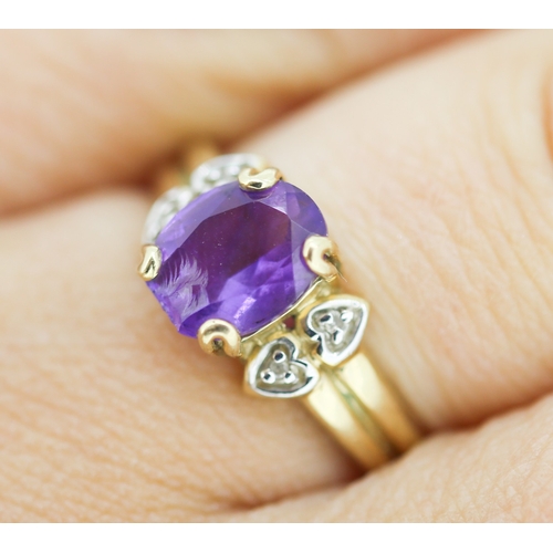 134 - Amethyst Set Ring with Diamond Inset to Shoulders Mounted in 9 Carat Yellow Gold Ring Size N