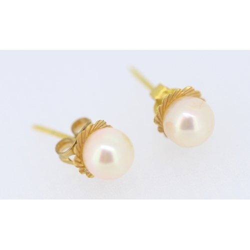 137 - Pair of Pearl Set Earrings Mounted in 9 Carat Yellow Gold 7mm High