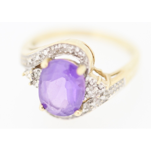138 - Amethyst Set Centre Stone Ring with Diamond Inset Decorated Swirl Motif Surround Mounted in 9 Carat ... 