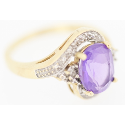 138 - Amethyst Set Centre Stone Ring with Diamond Inset Decorated Swirl Motif Surround Mounted in 9 Carat ... 