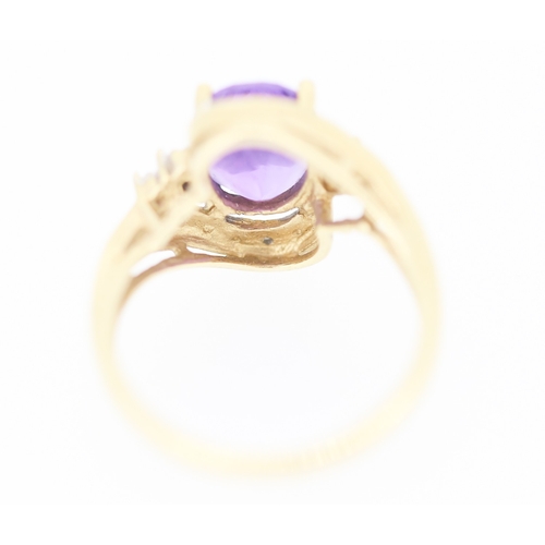 138 - Amethyst Set Centre Stone Ring with Diamond Inset Decorated Swirl Motif Surround Mounted in 9 Carat ... 