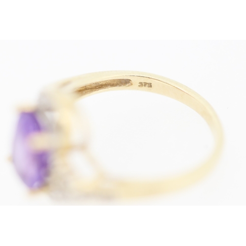 138 - Amethyst Set Centre Stone Ring with Diamond Inset Decorated Swirl Motif Surround Mounted in 9 Carat ... 