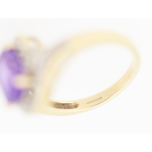 138 - Amethyst Set Centre Stone Ring with Diamond Inset Decorated Swirl Motif Surround Mounted in 9 Carat ... 