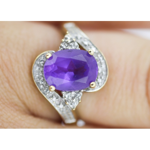 138 - Amethyst Set Centre Stone Ring with Diamond Inset Decorated Swirl Motif Surround Mounted in 9 Carat ... 