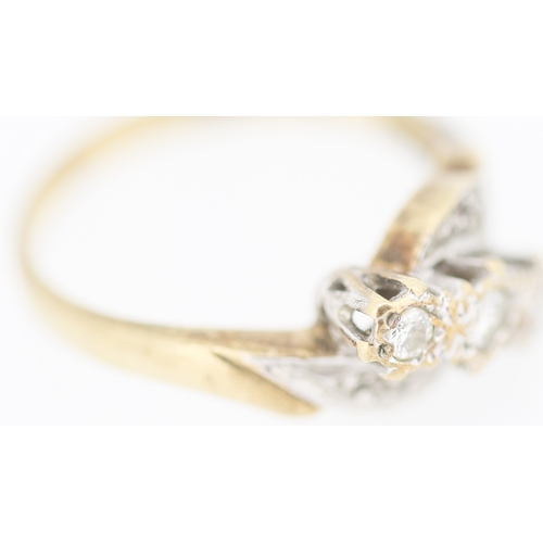 139 - Finely Detailed Diamond Three Stone Ring Mounted in 9 Carat Yellow Gold with Further Diamond Insets ... 