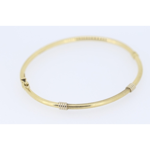141 - 9 Carat Yellow Gold Bangle Bracelet with White Gold Knot Motifs Inner Width 6.5cm