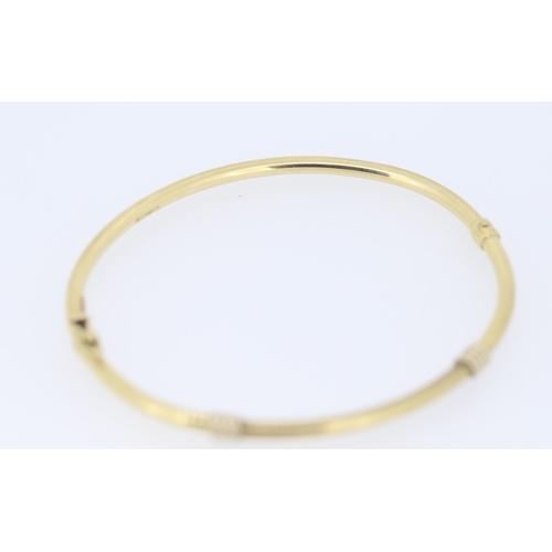 141 - 9 Carat Yellow Gold Bangle Bracelet with White Gold Knot Motifs Inner Width 6.5cm