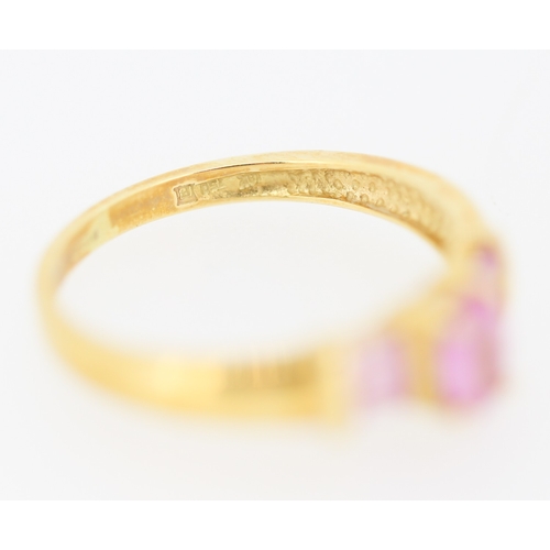 170 - Oval Cut Pink Sapphire Set Ring with Further Baguette Cut Pink Sapphires Set to Shoulders Mounted in... 