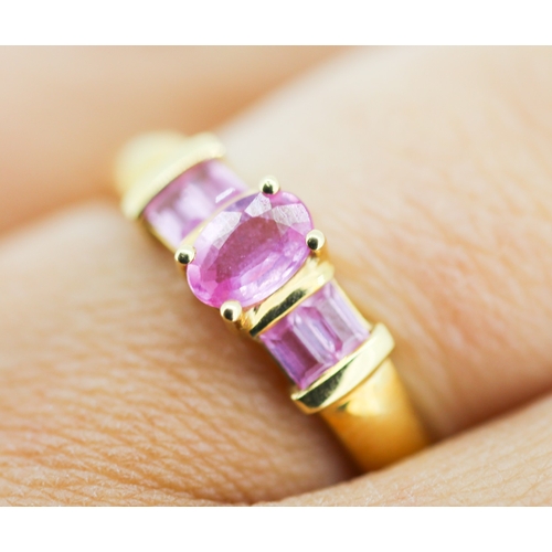 170 - Oval Cut Pink Sapphire Set Ring with Further Baguette Cut Pink Sapphires Set to Shoulders Mounted in... 