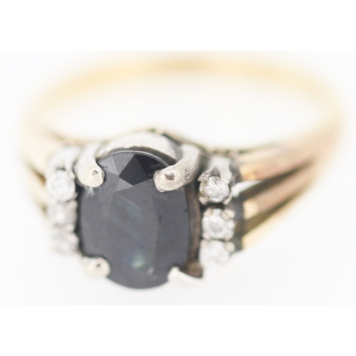 173 - Sapphire Set Ring with Diamond Inset to Shoulders Mounted in 9 Carat Yellow Gold Ring Size I and a H... 
