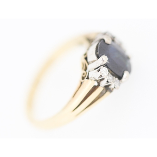 173 - Sapphire Set Ring with Diamond Inset to Shoulders Mounted in 9 Carat Yellow Gold Ring Size I and a H... 