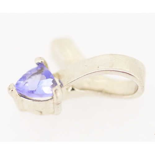 176 - Triangle Cut Tanzanite Set Ribbon Form Pendant Mounted in 9 Carat White Gold 1.5cm High