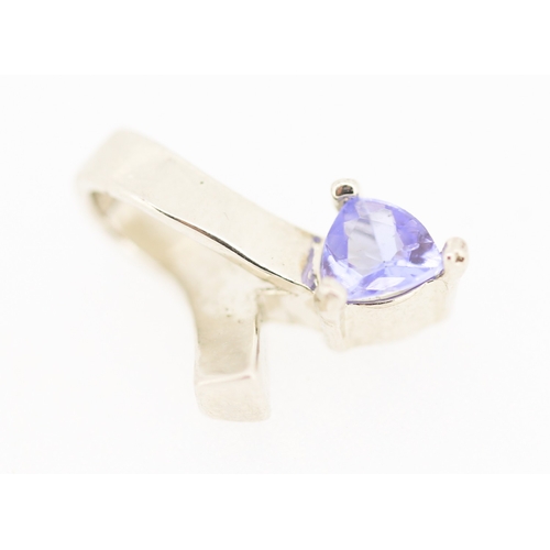 176 - Triangle Cut Tanzanite Set Ribbon Form Pendant Mounted in 9 Carat White Gold 1.5cm High