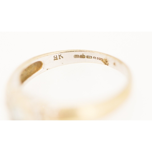 178 - Bezel Set Aquamarine Ring with Diamond Inset to Shoulders Mounted in 9 Carat Yellow Gold Ring Size N