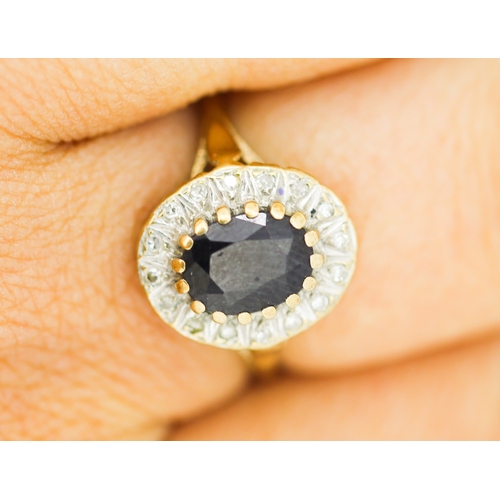 179 - Sapphire Set Centre Stone Ring with Diamond Set Surround Mounted in 9 Carat Yellow Gold Ring Size Q ... 