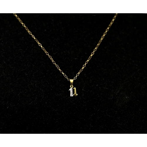 9 Carat Yellow Gold Letter U Diamond Inset Pendant 1cm High Set on 9 Carat Yellow Gold Chain 45cm Long As New Unworn Shop Stock Inherited by Vendor