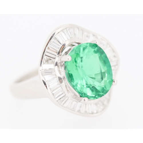 61 - Finely Detailed Emerald Set Centre Stone Ring with Tapered Baguette Cut Diamond Set Halo Surround Mo... 