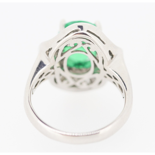 61 - Finely Detailed Emerald Set Centre Stone Ring with Tapered Baguette Cut Diamond Set Halo Surround Mo... 