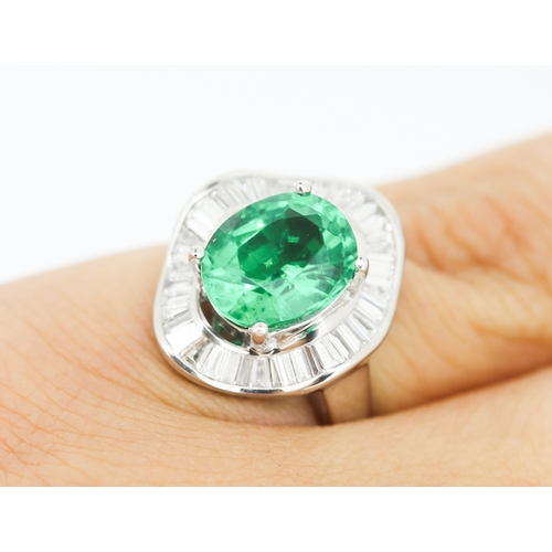 61 - Finely Detailed Emerald Set Centre Stone Ring with Tapered Baguette Cut Diamond Set Halo Surround Mo... 