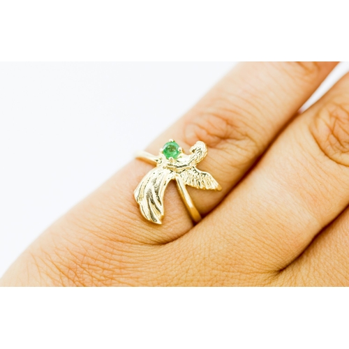 Attractively Detailed Emerald Set Angel Motif Ring Mounted in 9 Carat Yellow Gold Ring Size K and a Half