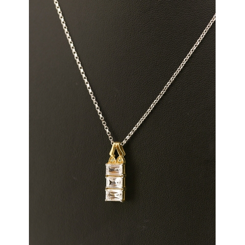 60 - White Topaz Three Stone Set Pendant Mounted in 9 Carat Yellow Gold 2cm High Set on 18 Carat White Go... 