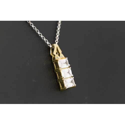 60 - White Topaz Three Stone Set Pendant Mounted in 9 Carat Yellow Gold 2cm High Set on 18 Carat White Go... 