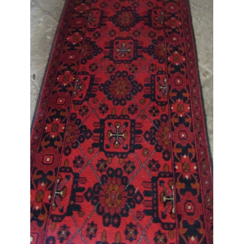 19 - Persian Pure New Wool Runner Burgundy and Navy Ground Approximately 10ft 6 Inches Long