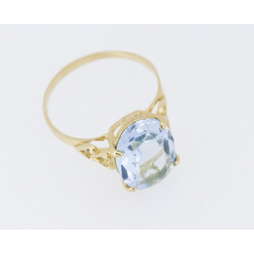 1 - Sky Blue Topaz Single Stone Set Ring Mounted in 9 Carat Yellow Gold Heart Motifs to Shoulders Stone ... 