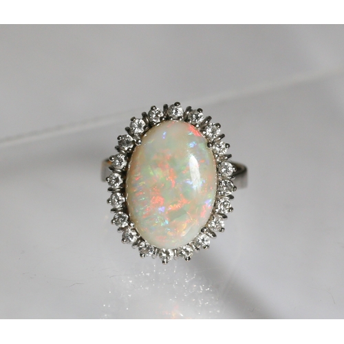 11 - Attractively Detailed Opal Centre Stone Ring with Diamond Twenty Stone Set Halo Surround Mounted in ... 