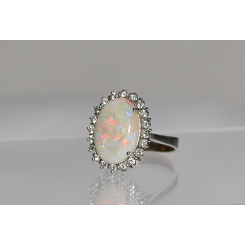 11 - Attractively Detailed Opal Centre Stone Ring with Diamond Twenty Stone Set Halo Surround Mounted in ... 