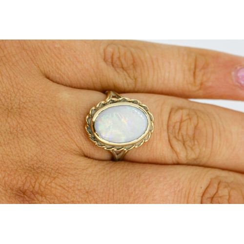 16 - Bezel Set Opal Single Stone Ring Mounted in 9 Carat Yellow Gold Opal 14mm by 10mm Ring Size N and a ... 