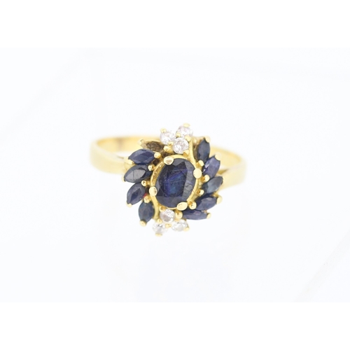 Attractively Detailed Sapphire Centre Stone Ring with Diamond and Marquise Cut Sapphire Set Surround Mounted in 18 Carat Yellow Gold Centre Stone Approximately 1ct  Ring Size V Note One Stone Lacking