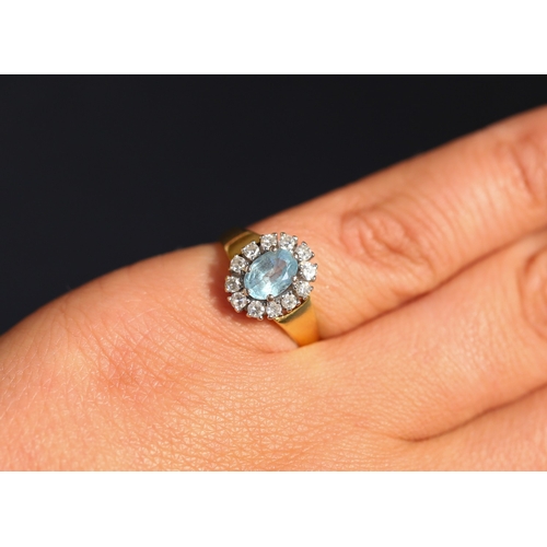 24 - Aquamarine Centre Stone Set Ring with Diamond Set Halo Surround Mounted in 18 Carat Yellow Gold Aqua... 