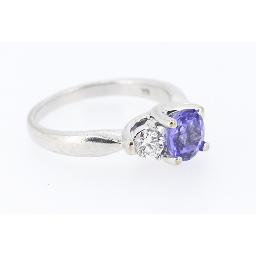 39 - Tanzanite and Diamond Set Three Stone Ring Mounted in 18 Carat White Gold Tanzanite Approximately .8... 