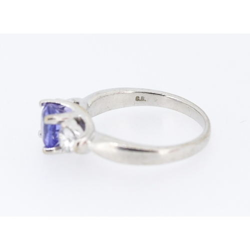 39 - Tanzanite and Diamond Set Three Stone Ring Mounted in 18 Carat White Gold Tanzanite Approximately .8... 