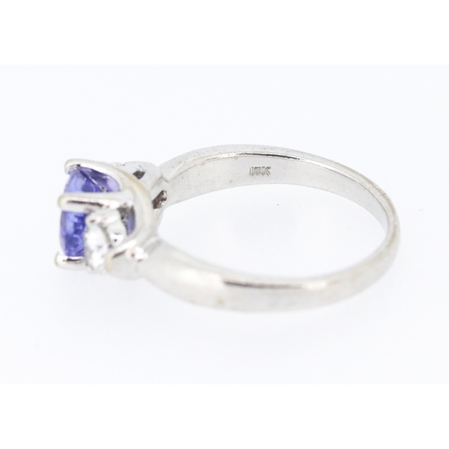 39 - Tanzanite and Diamond Set Three Stone Ring Mounted in 18 Carat White Gold Tanzanite Approximately .8... 