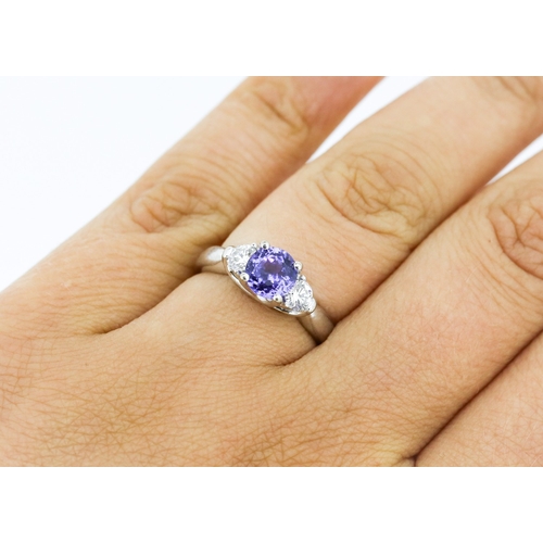 39 - Tanzanite and Diamond Set Three Stone Ring Mounted in 18 Carat White Gold Tanzanite Approximately .8... 