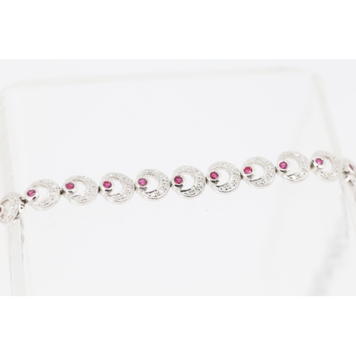 55 - Attractively Detailed Diamond and Ruby Set Crecent Form Ladies Bracelet Mounted in 18 Carat White Go... 