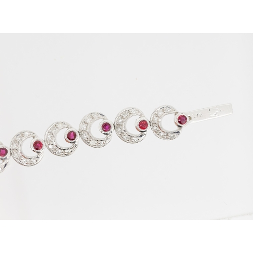 55 - Attractively Detailed Diamond and Ruby Set Crecent Form Ladies Bracelet Mounted in 18 Carat White Go... 